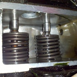 Valve chamber - intake valve is stuck open, causing the engine to backfire through the carb.