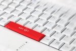 87943585-white-computer-keyboard-with-red-any-key-button-conceptual-key-on-keyboard-.jpg