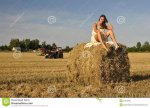 girl-rural-clothing-sitting-haystack-21020916.jpg