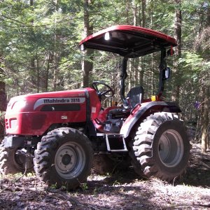 Mahindra 2810HST in the woods working on the "main" road. This road is 1 mile long.