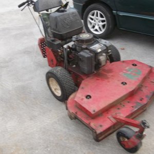 It has a 14 hp Kawasaki that pulls under a load like my 17 hp does. Starts on the first pull every time!