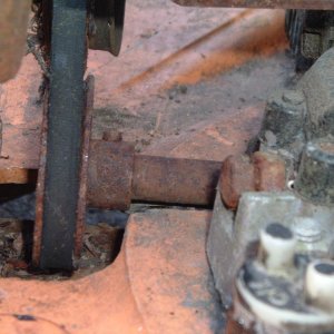 The Briggs 4 HP motor has two driveshafts; this one is connected to a gear reducer and comes out the side to power the drive system.