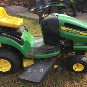 Right Side
Lots of paint chipping off. Same is true of the mower deck.  Body and frame seem to be intact, so just a paint job and cleaning might just 