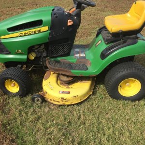 Left Side
Left is same as the right side loss of paint as it chips off the body and most is missing on the mower deck.