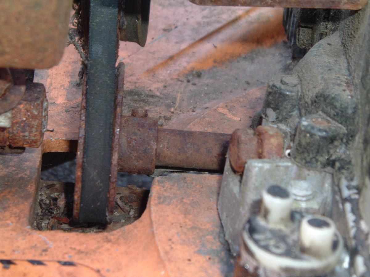 The Briggs 4 HP motor has two driveshafts; this one is connected to a gear reducer and comes out the side to power the drive system.